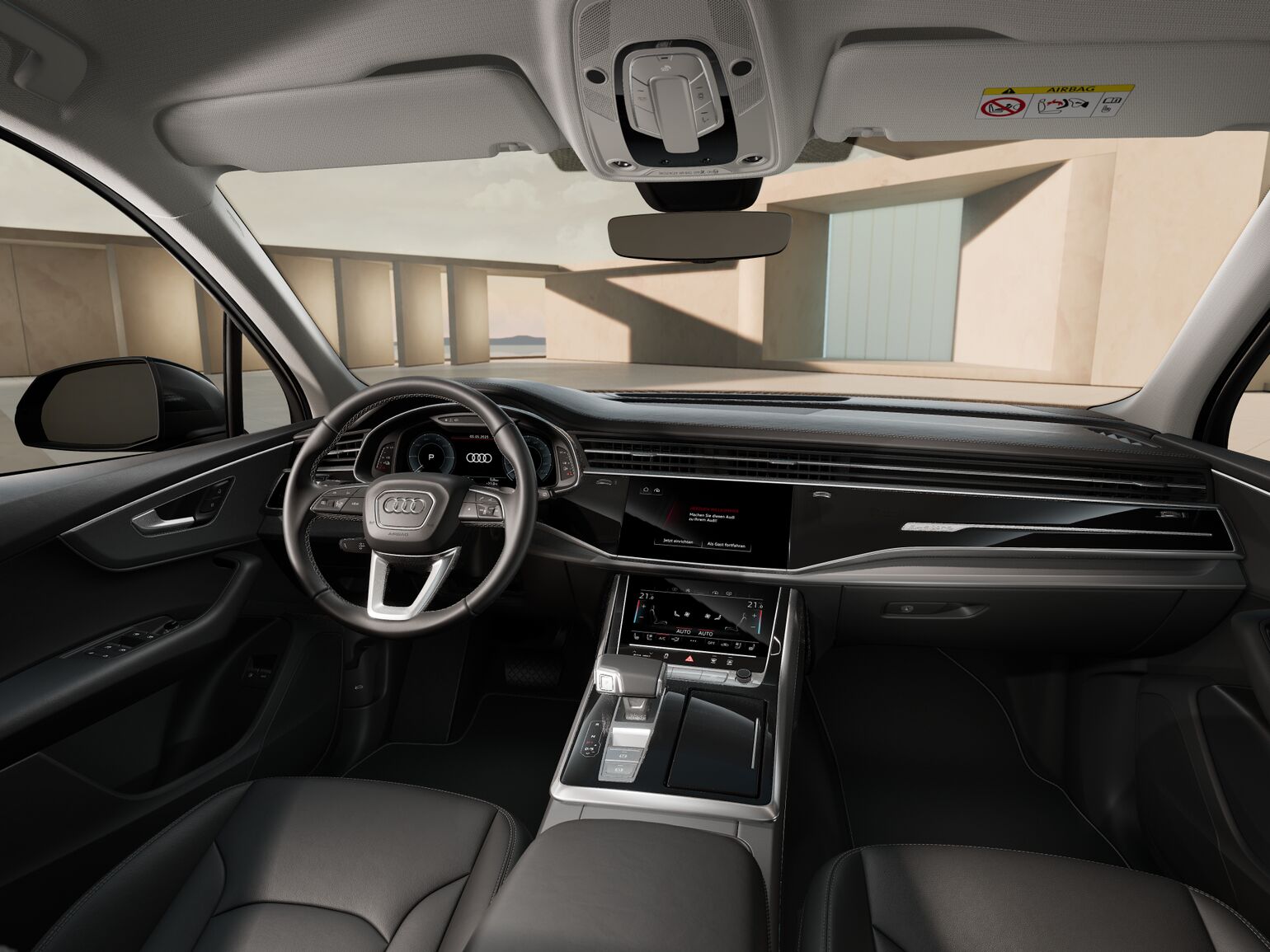 Innenraumansicht des Audi Q7 mit Lenkrad, virtuellem Cockpit und großem Zentraldisplay